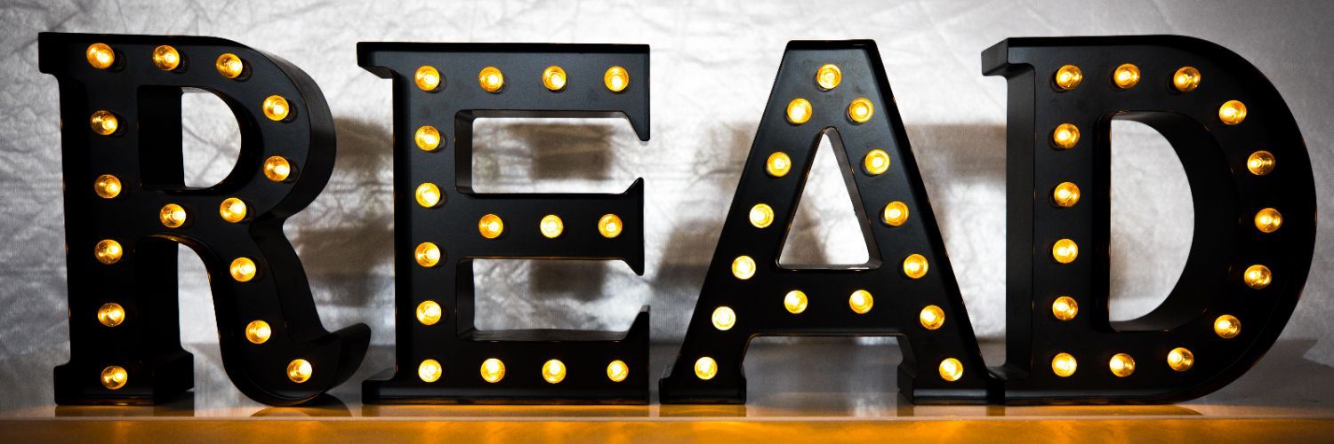 Letters that spell "READ" light up